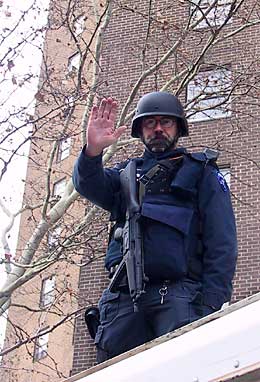 The man on the truck with the assault rifle is not real.